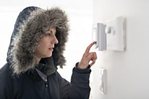 Homeowner turns on the furnace thermostat